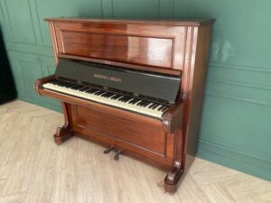 Hornung & Moller grand piano, made in Germany, plays normally on all keys.