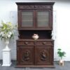 Tall buffet cabinet, carved wood with bird pattern. European work comes from Germany.