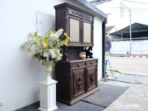 Tall buffet cabinet, carved wood with bird pattern. European work comes from Germany.
