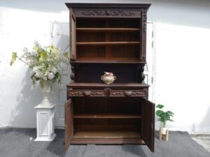 Tall buffet cabinet, carved wood with bird pattern. European work comes from Germany.