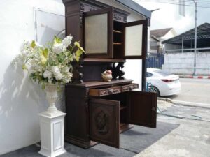 Tall buffet cabinet, carved wood with bird pattern. European work comes from Germany.