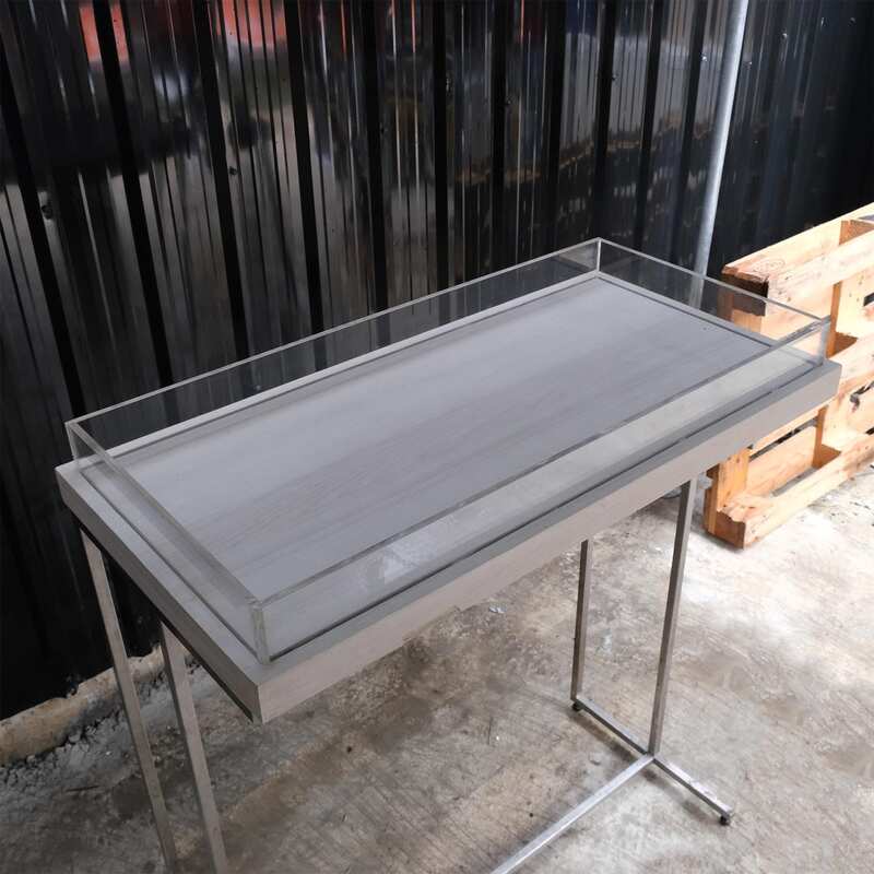 Tall wooden product display tray, attached to a clear acrylic frame. Product shelves, steel leg frame