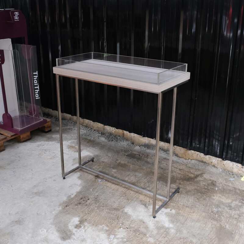 Tall wooden product display tray, attached to a clear acrylic frame. Product shelves, steel leg frame