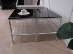 glass center table Center table, steel frame, with shelves under the table.