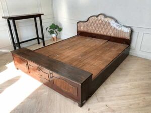 6-foot wooden bed, fabric-covered headboard, with storage cabinet at the end of the bed