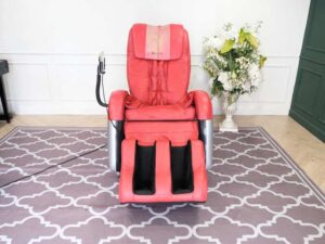 Massage chair, reclining, electric system, red leather seats, Makoto brand.