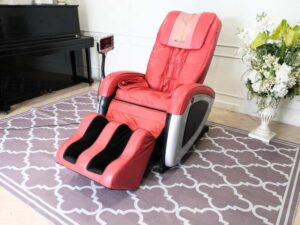 Massage chair, reclining, electric system, red leather seats, Makoto brand.