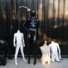 The mannequin showcases a full-body black women's shirt