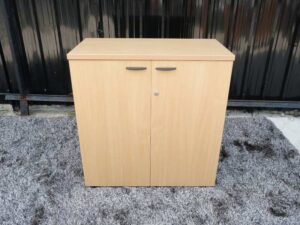 File cabinet with 2 doors, gray color, light wood top, Rockworth brand.