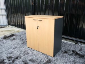 File cabinet with 2 doors, gray color, light wood top, Rockworth brand.
