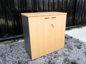 File cabinet with 2 doors, gray color, light wood top, Rockworth brand.