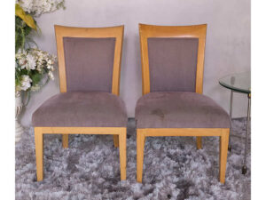 Wooden chair with purple fabric cushion, beautiful design.