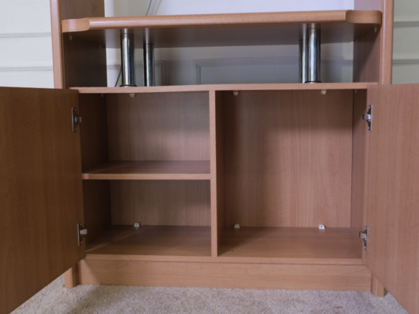 Tall TV cabinet with 4 opening doors, wooden frame, glass top, brown.