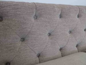 Tuxedo sofa, 2-3 seats, fabric upholstery, brown button-pull backrest, wooden frame, black legs