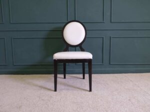 dining chair White leather seats, black wood frame.