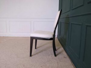 dining chair White leather seats, black wood frame.