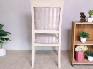 Wooden chair, purple cloth cushion with straight pattern, beautiful frame, cushioned backrest.