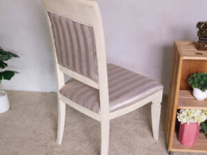 Wooden chair, purple cloth cushion with straight pattern, beautiful frame, cushioned backrest.
