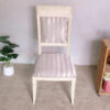 Wooden chair, purple cloth cushion with straight pattern, beautiful frame, cushioned backrest.