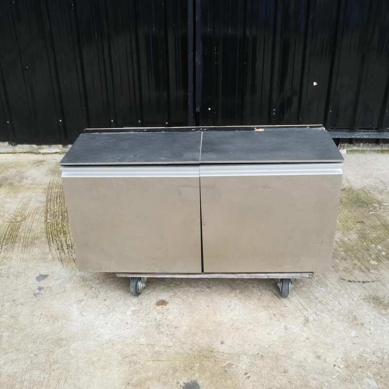 Multi-purpose storage cabinet, low shape, made from wood with stainless steel panels on the outside.