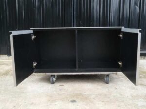 Multi-purpose storage cabinet, low shape, made from wood with stainless steel panels on the outside.