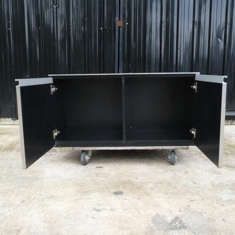 Multi-purpose storage cabinet, low shape, made from wood with stainless steel panels on the outside.
