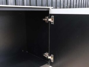 Multi-purpose storage cabinet, low shape, made from wood with stainless steel panels on the outside.