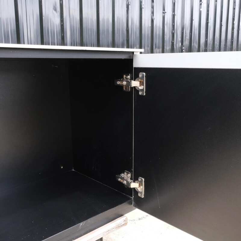 Multi-purpose storage cabinet, low shape, made from wood with stainless steel panels on the outside.