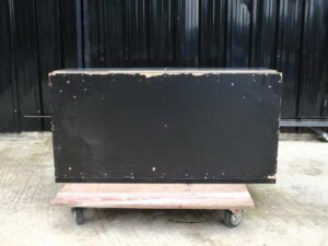 Multi-purpose storage cabinet, low shape, made from wood with stainless steel panels on the outside.