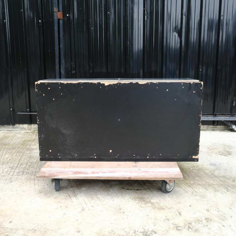 Multi-purpose storage cabinet, low shape, made from wood with stainless steel panels on the outside.
