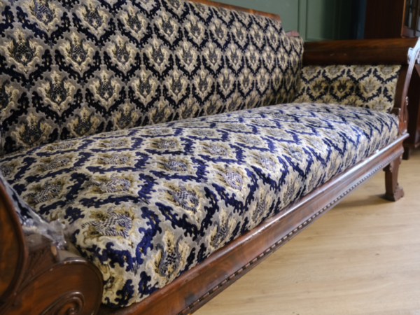 2 seat wooden sofa, mahogany color, classic pattern. European work comes from Germany.