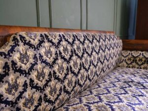 2 seat wooden sofa, mahogany color, classic pattern. European work comes from Germany.