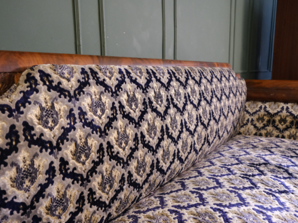 2 seat wooden sofa, mahogany color, classic pattern. European work comes from Germany.