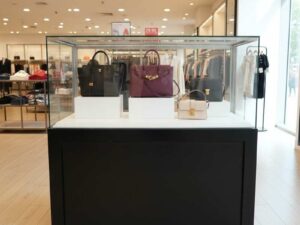 Jewelry showcase cabinet, display showcase cabinet, display cabinet, black wooden frame, white display base, 2 sliding doors, with wheels.