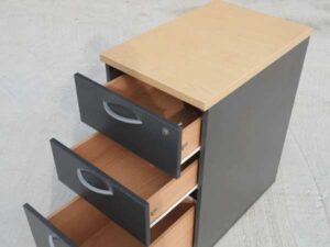 Gray wooden filing cabinet with 3 drawers, cream colored wood top. (no wheels/no key)