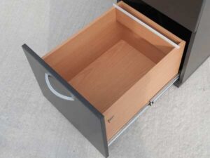 Gray wooden filing cabinet with 3 drawers, cream colored wood top. (no wheels/no key)