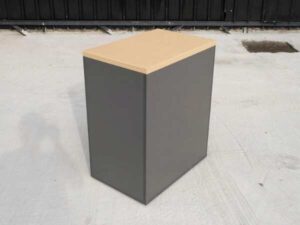 Gray wooden filing cabinet with 3 drawers, cream colored wood top. (no wheels/no key)