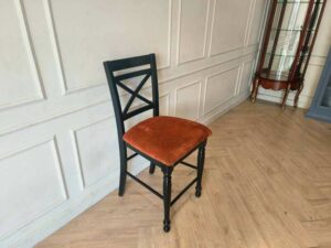 Wooden chair with brown fabric cushion, beautiful design.
