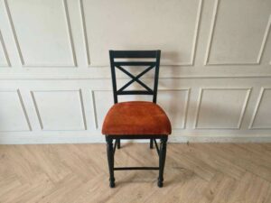 Wooden chair with brown fabric cushion, beautiful design.
