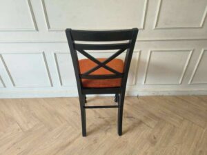 Wooden chair with brown fabric cushion, beautiful design.