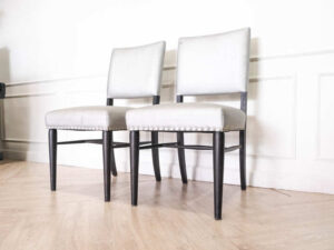 Gray silk leather chair, wooden frame, riveted backrest and seat.