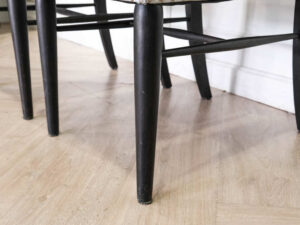 Gray silk leather chair, wooden frame, riveted backrest and seat.