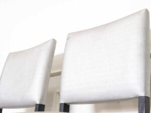 Gray silk leather chair, wooden frame, riveted backrest and seat.