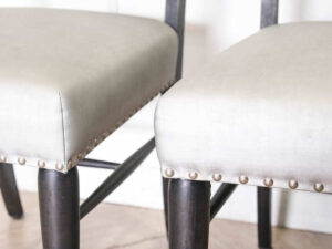 Gray silk leather chair, wooden frame, riveted backrest and seat.
