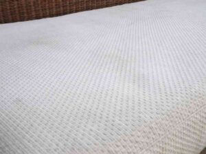 Rattan sofa, white cushion, modern design.
