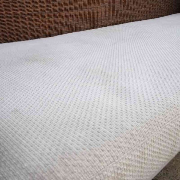 Rattan sofa, white cushion, modern design.