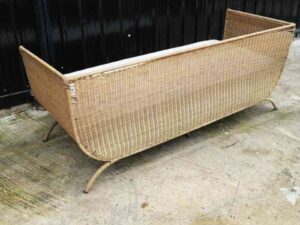 Rattan sofa, white cushion, modern design.