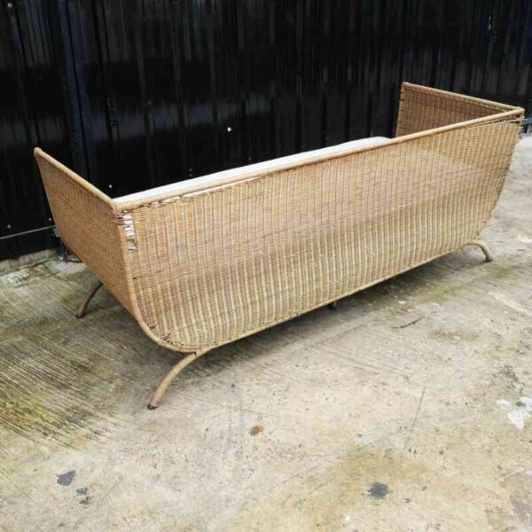 Rattan sofa, white cushion, modern design.