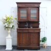 Classic style storage cabinet, carved wood, glass top, European craftsmanship, sourced from Germany.