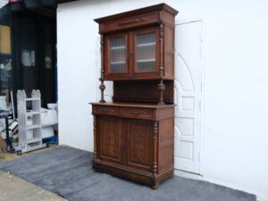 Classic style storage cabinet, carved wood, glass top, European craftsmanship, sourced from Germany.
